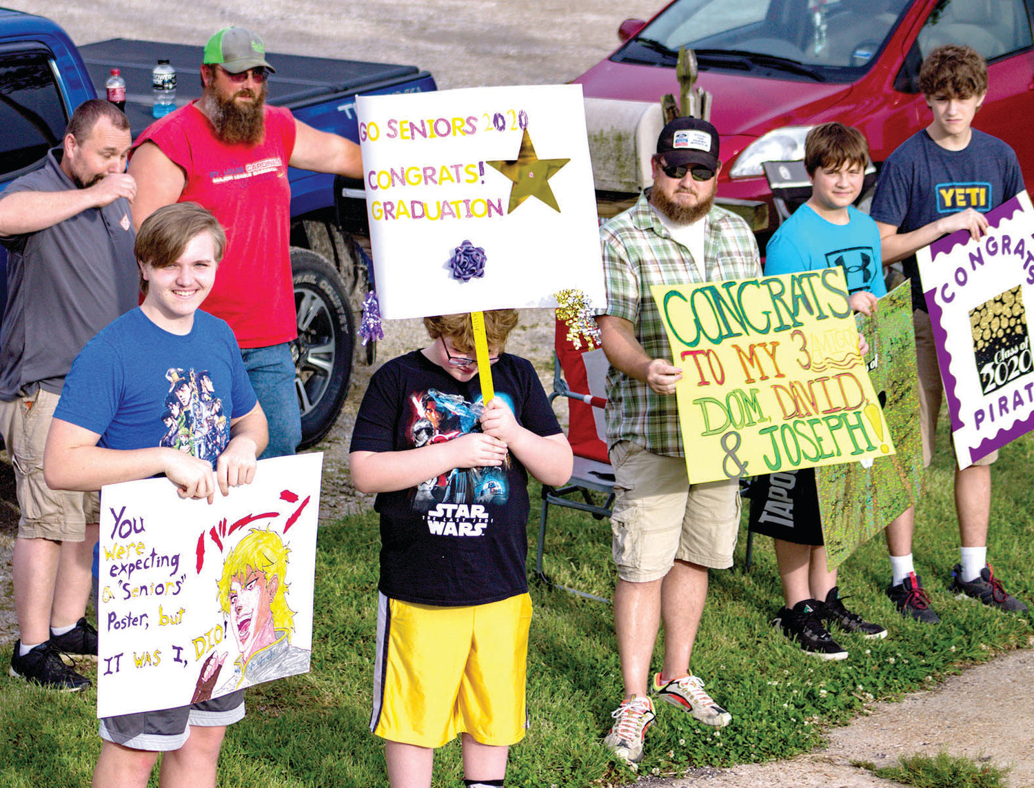 Signs and smiles were the theme as Chamois graduates took part in a parade on Friday.